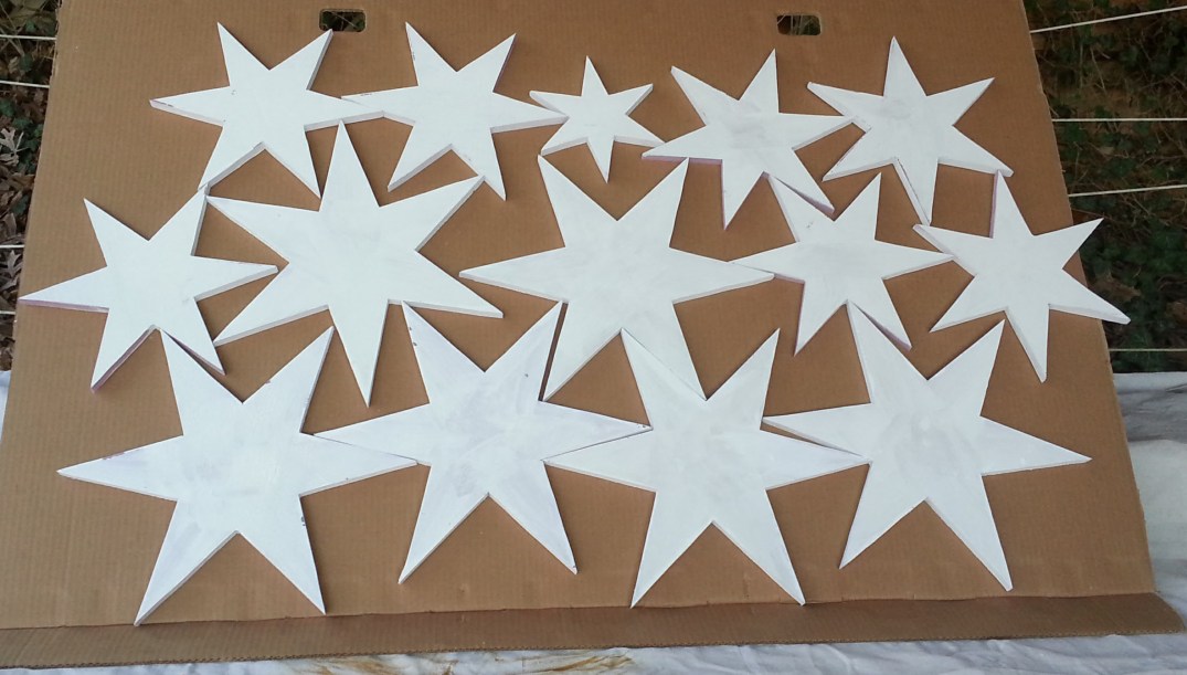foam stars painted white before painting with metallics