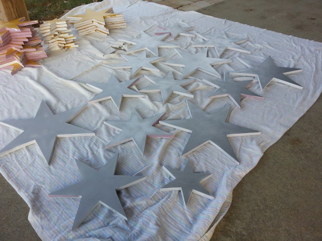 More than 30 stars in various stages of being painted.